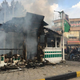 Iranians gather around a police station set ablaze by protesters in the central city of Isfahan on November 17, 2019